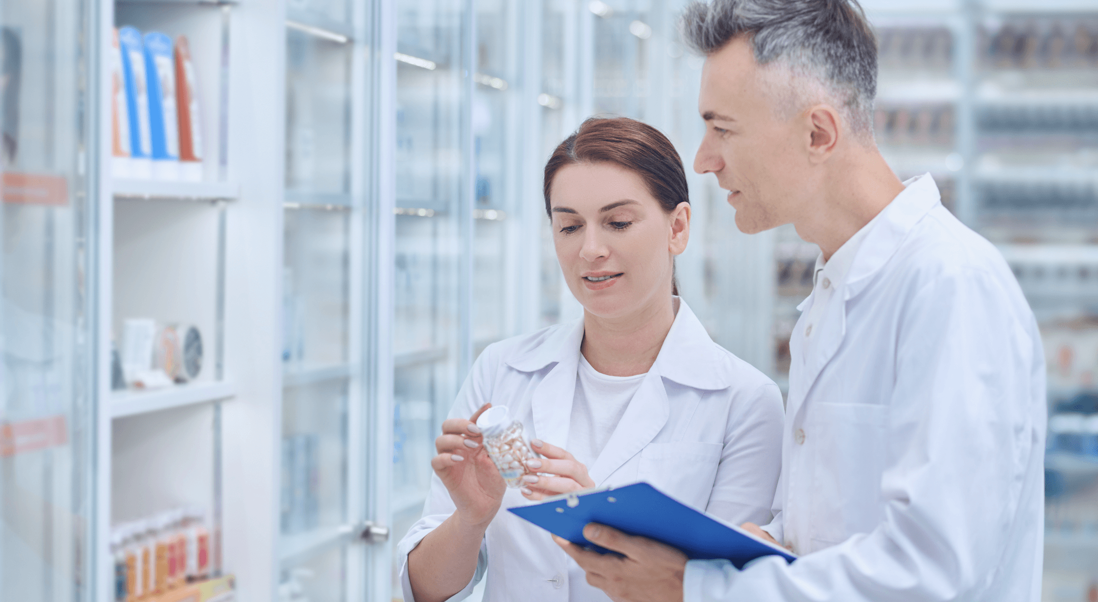 Pharmacy professionals focusing on patient care with Medility PillEye
